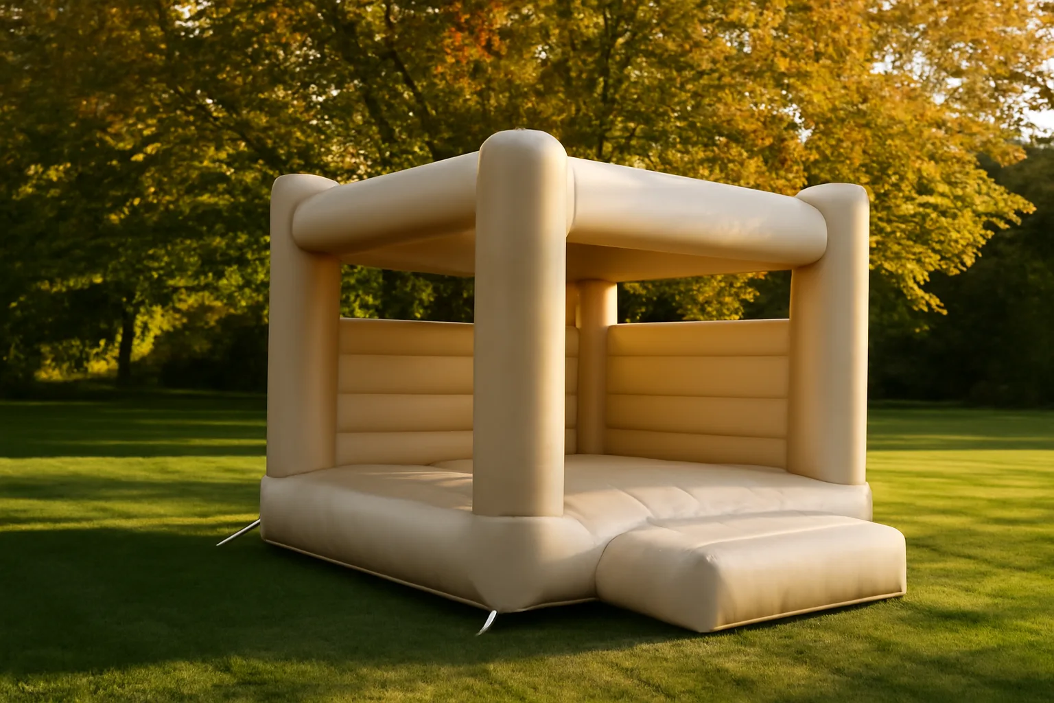 Staked bounce house on a suburban lawn in late afternoon light