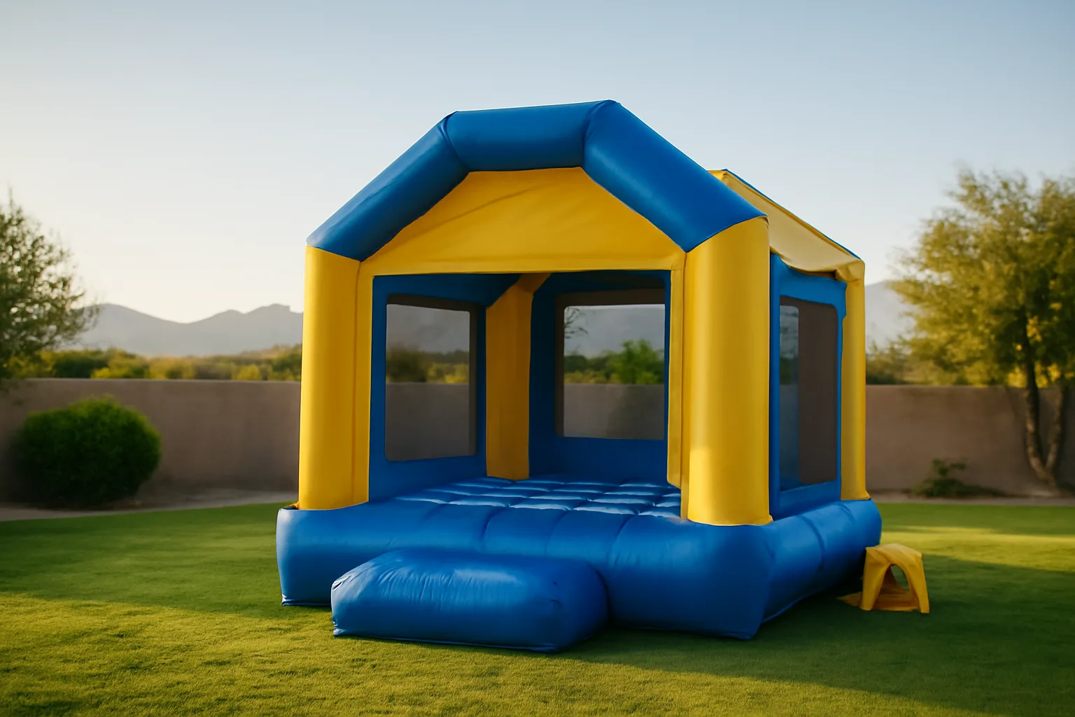 Inflatable bounce house rental in a Phoenix backyard